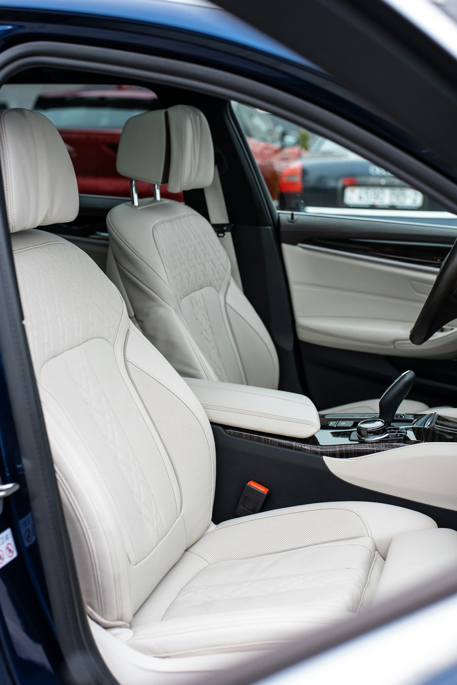Clean white leather front seats in a modern car
