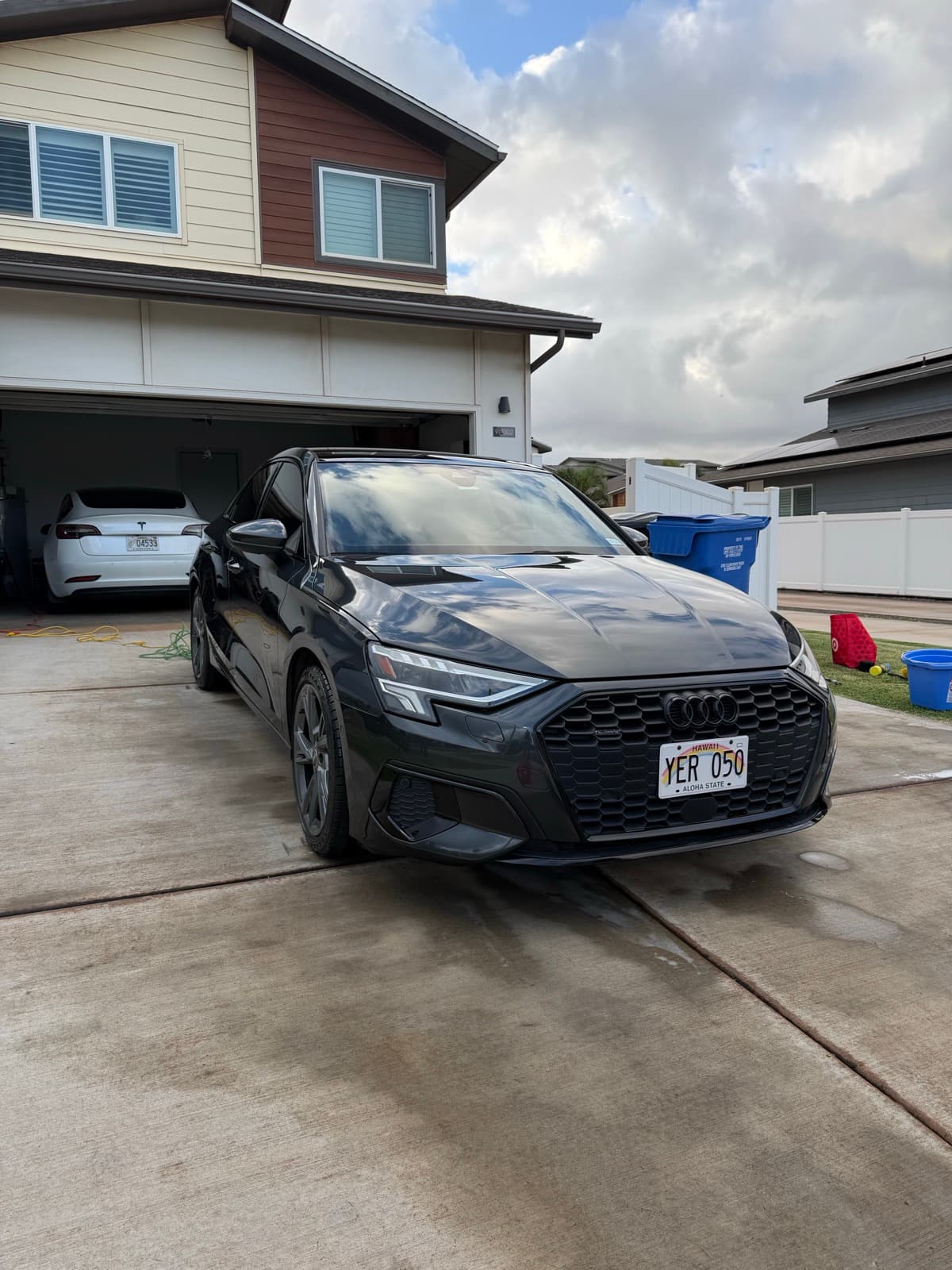Dark Audi RS exterior detail in residential driveway — Aiea, Oahu Hawaii