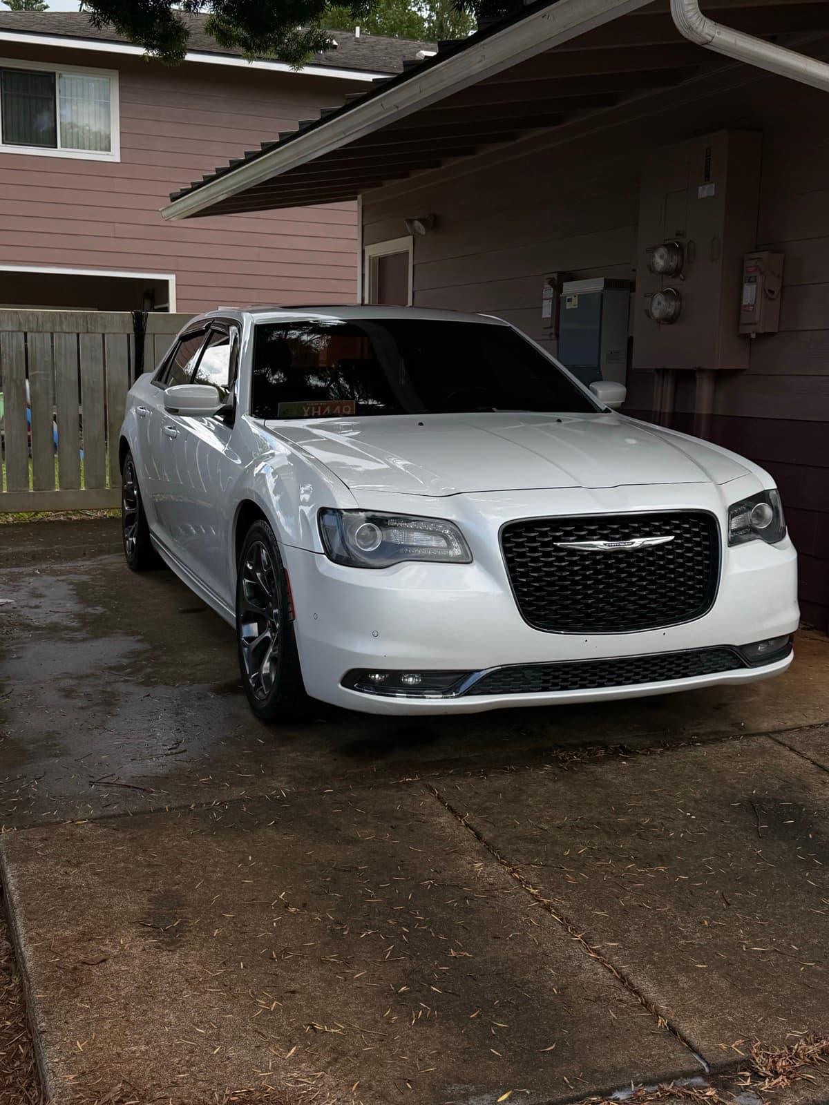 White Chrysler 300 exterior detail in residential driveway — Pearl City, Oahu Hawaii