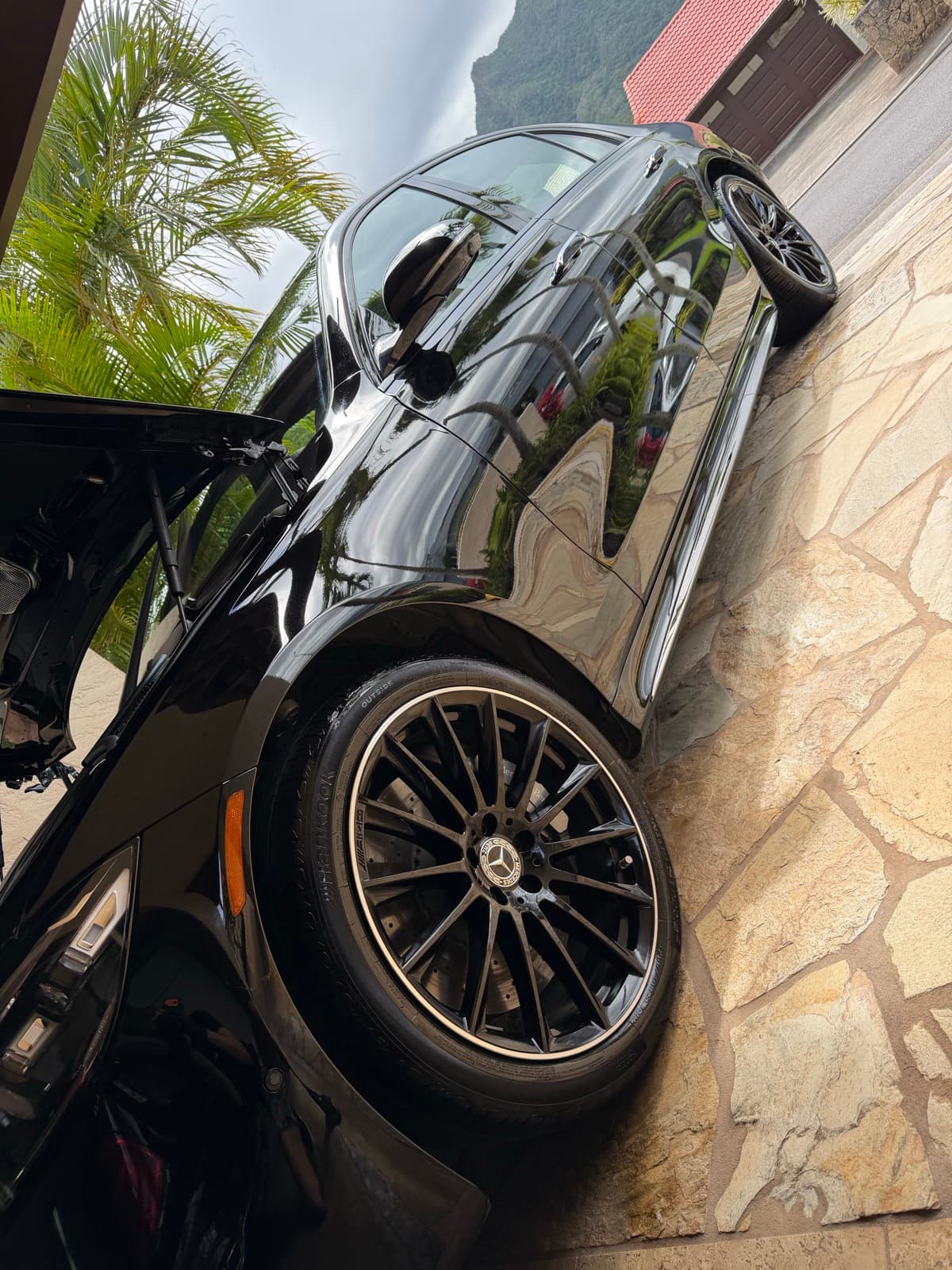 Black Mercedes-Benz exterior detail with luxury wheel detailing — Hawaii Kai, Oahu Hawaii