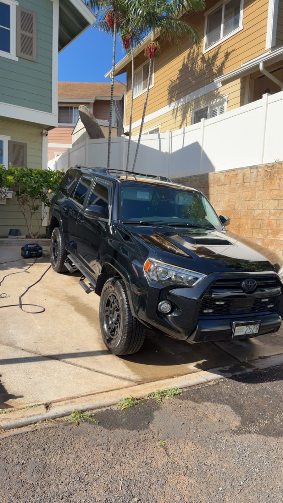Black Toyota 4Runner TRD exterior detail in residential driveway — Honolulu, Oahu Hawaii