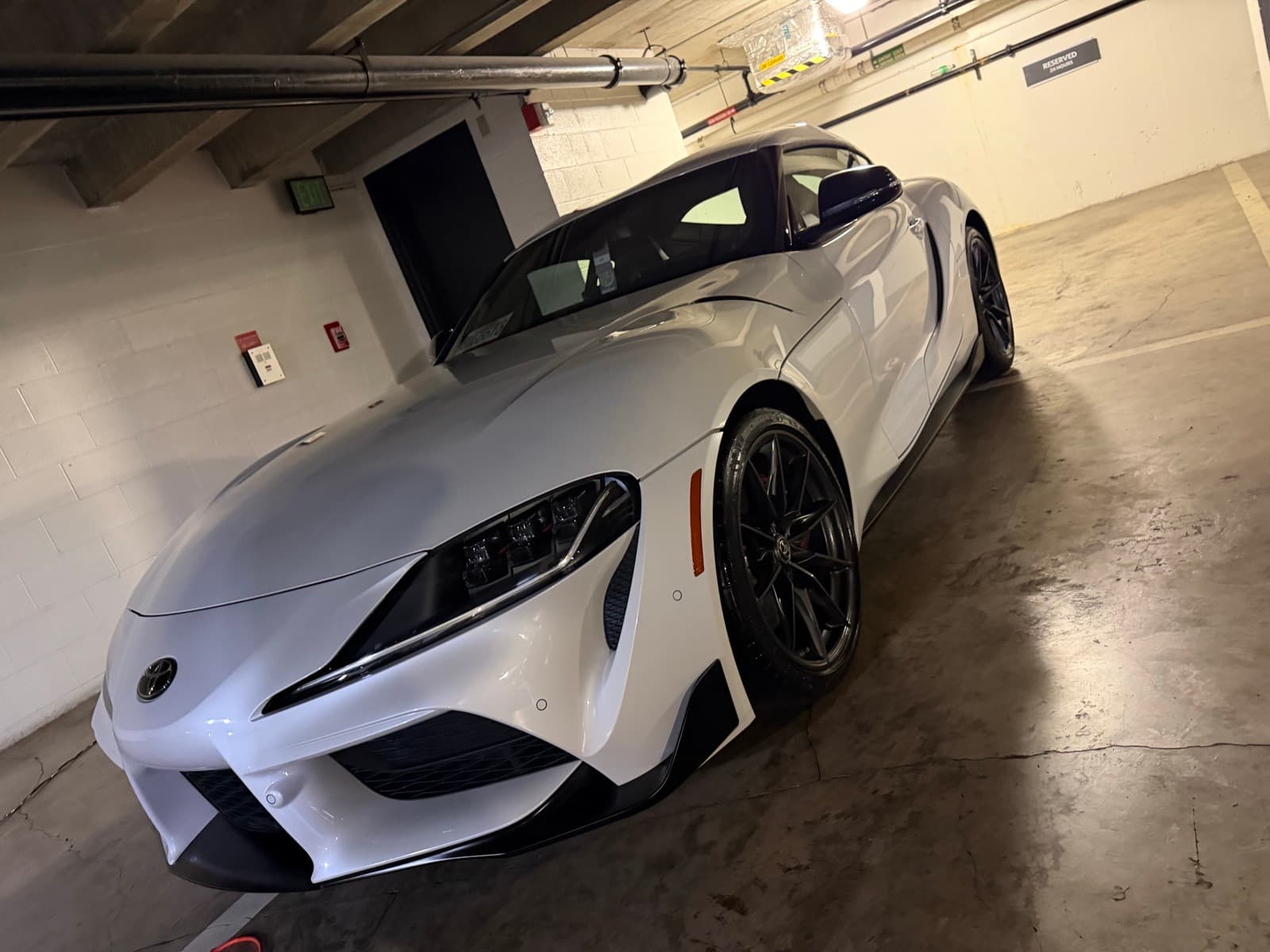 White Toyota GR Supra exterior detail — Honolulu condo parking garage, Oahu Hawaii